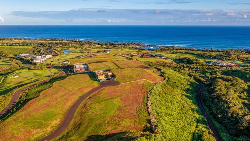 aerial view of kukuiula lots with one home under construction