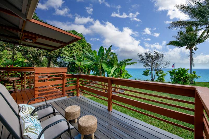 seating on lanai facing the ocean at house for sale on hamakua coast big island