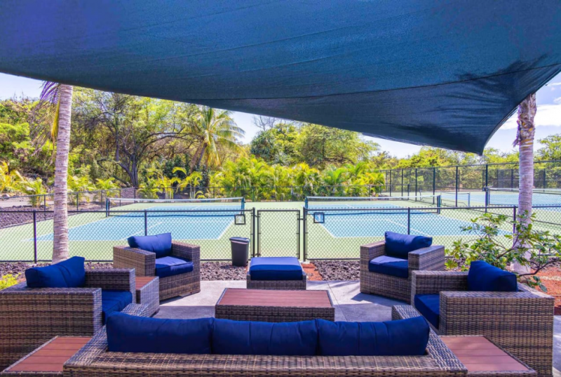 shaded lounge area near pickleball courts at hokulia