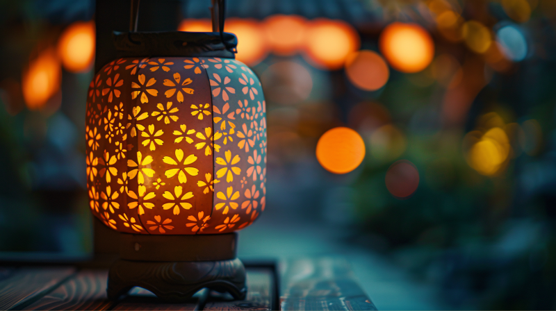 lantern with flower designs glowing at night