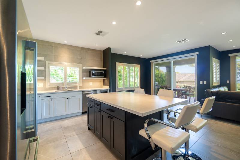 kitchen with large island with barstools