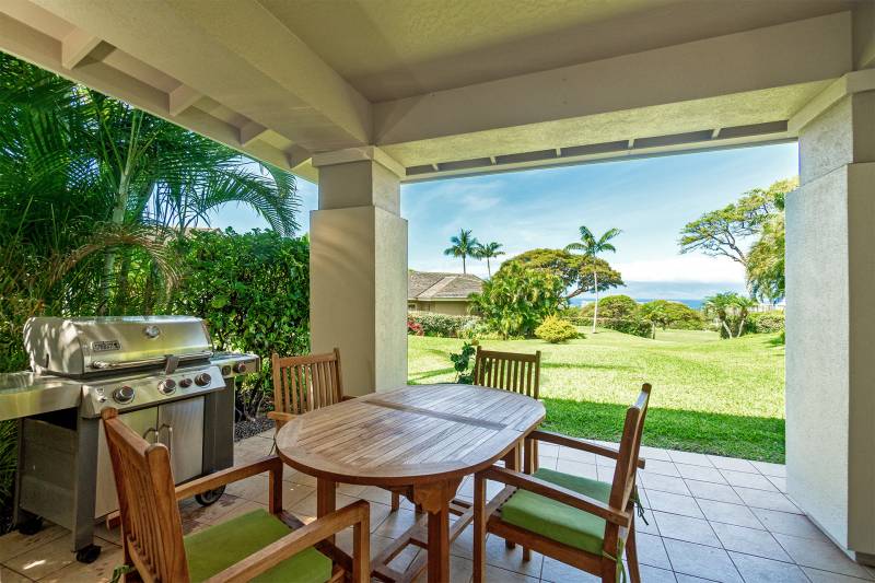 covered outdoor barbecue and seating area