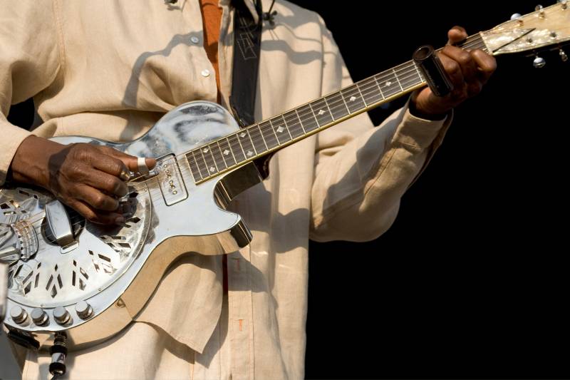 man playing steel guitar