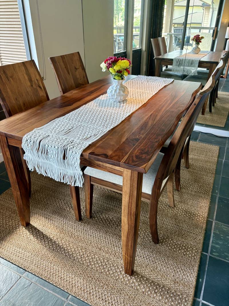 wooden table and chairs in dining space in maui condo