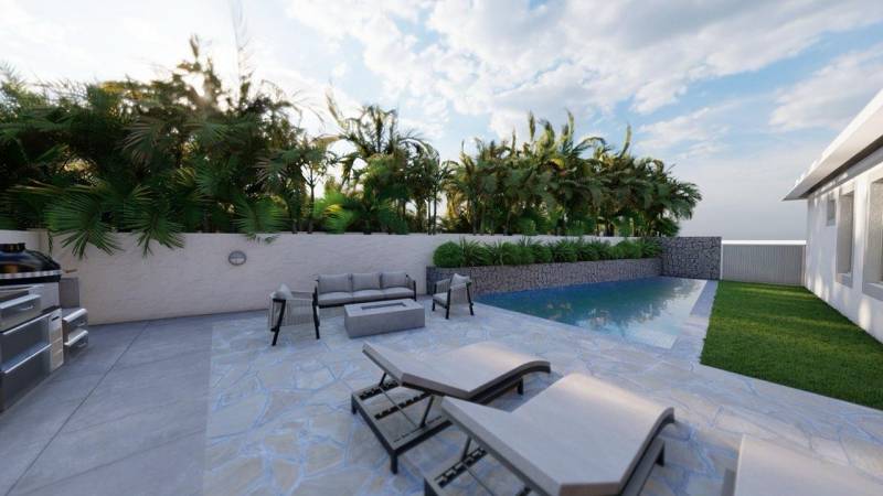 lounge chairs and seating area next to pool