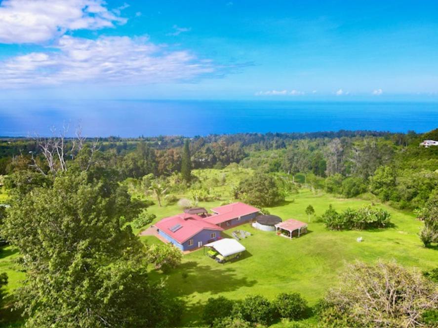 aerial view of captain cook hawaii property for sale with ocean in background