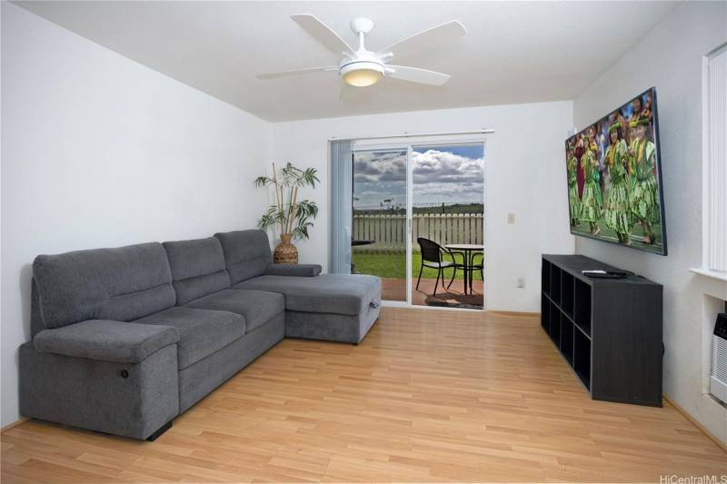 gray sofa in living room in oahu condo for sale