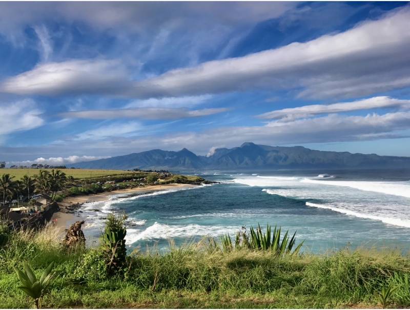 beautiful beach in Hookipa Maui with mountains in background