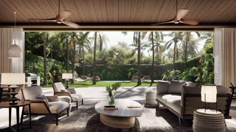 seating area with large windows that frame tropical landscaping in honolulu hawaii