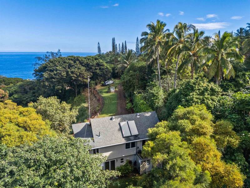 aerial view of house in haiku maui with ocean views