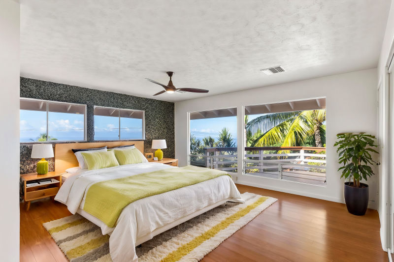 primary bedroom with ocean views through the large windows