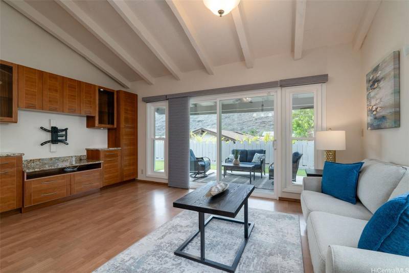 spacious living room with built in cabinetry