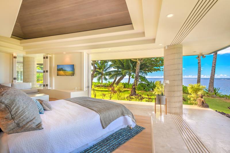 bedroom with large sliding doors to let in kauai ocean views