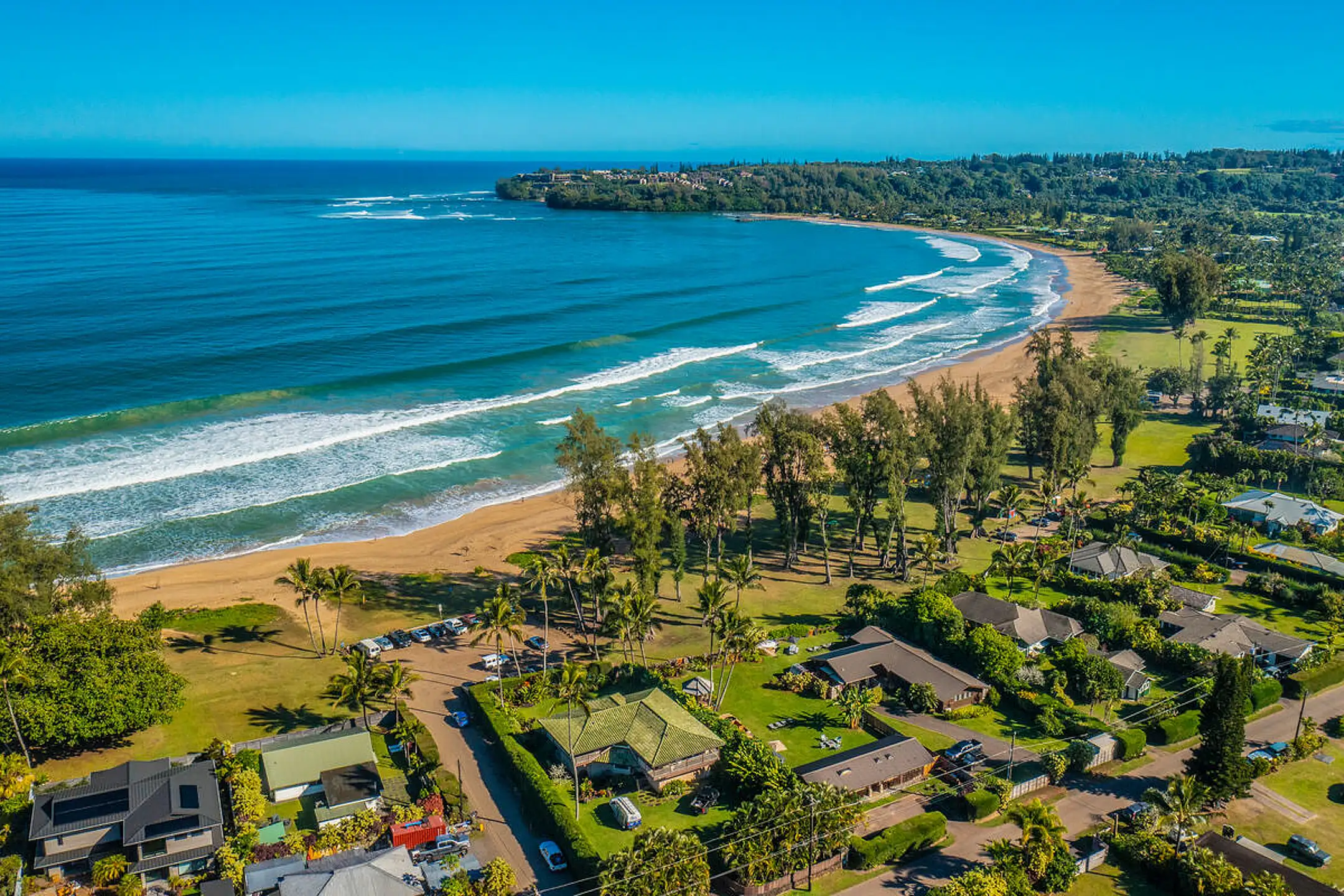 A modern Kauai luxury home for sale with an infinity pool overlooking the ocean.
