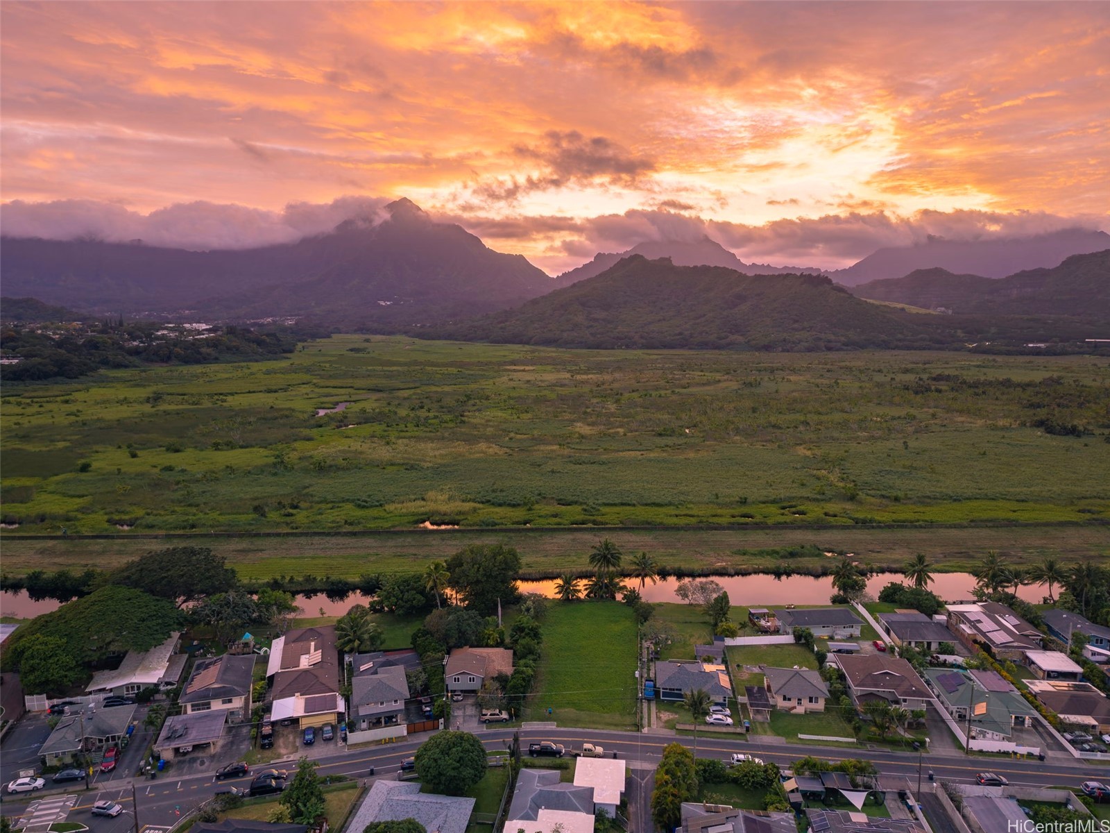 Aerial view of Kihapai Ohana residential CPR property in Kailua with canal frontage and Koʻolau Mountain backdrop