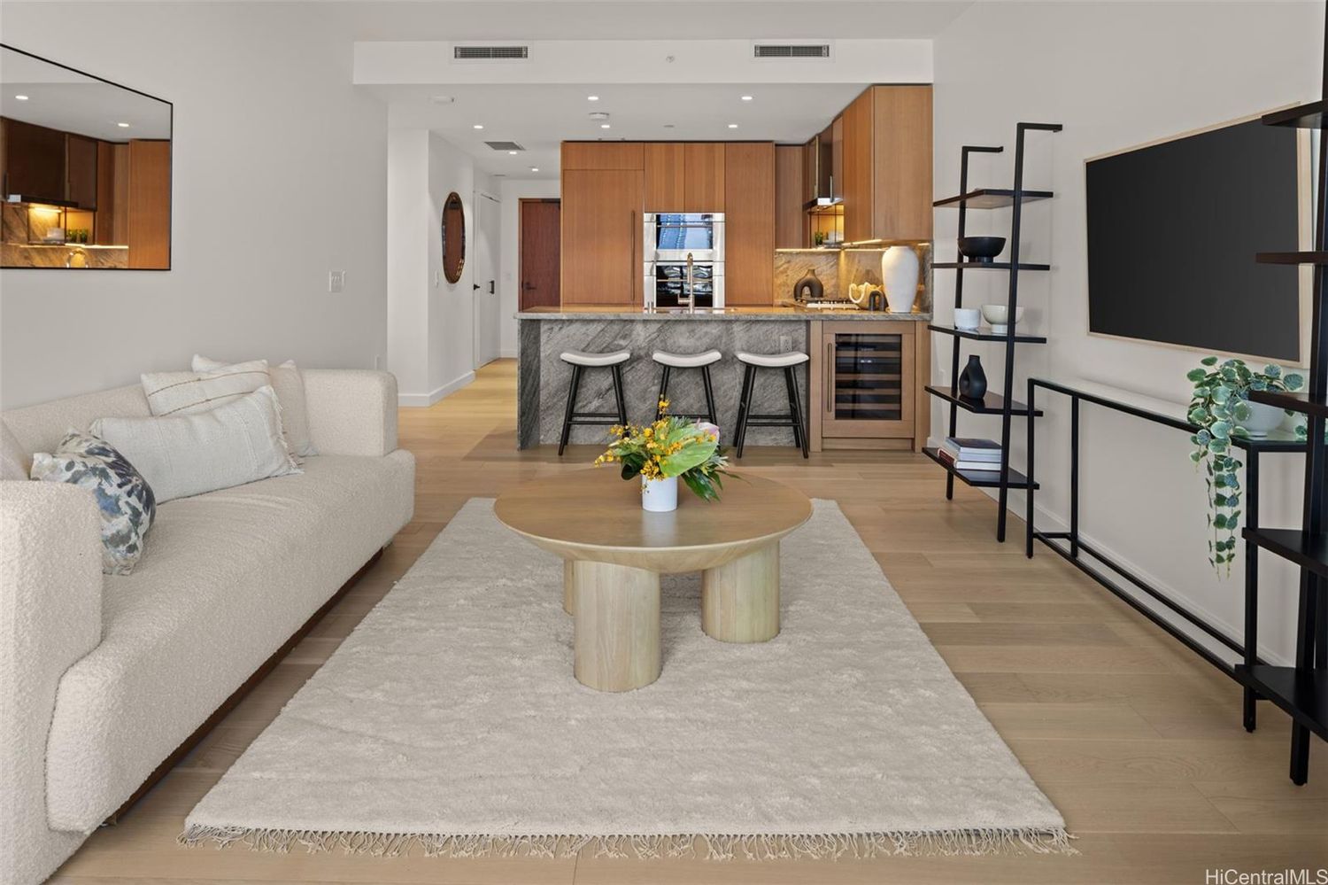 Spacious living room in Victoria Place Residence #807, fully furnished with modern décor and 