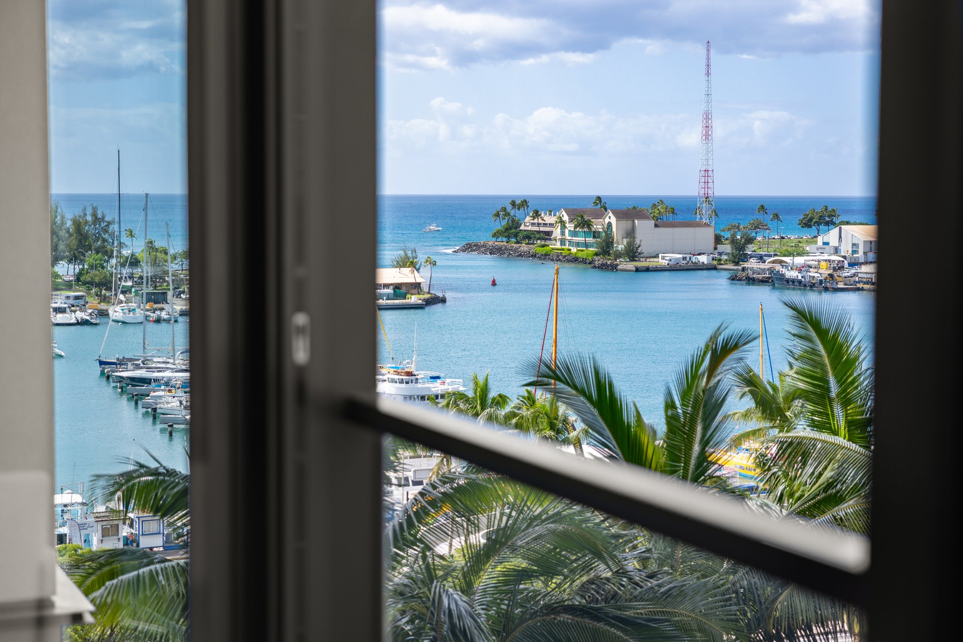 Ocean-facing windows overlooking Kewalo Harbor