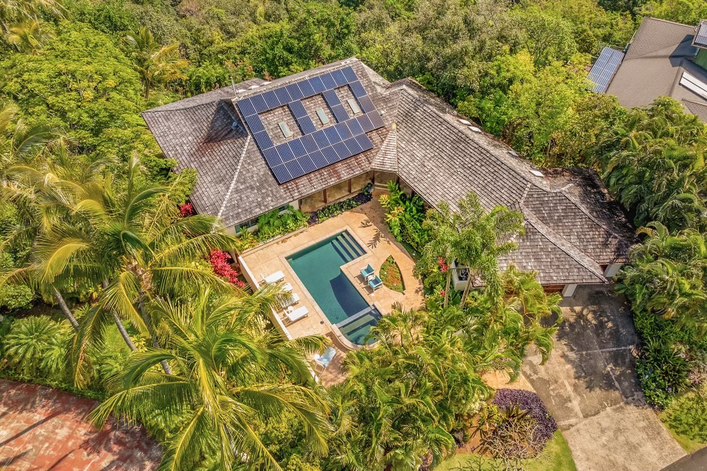Aerial view of a Kauaʻi home for sale surrounded by tropical landscaping — selling on Kauaʻi in 2026