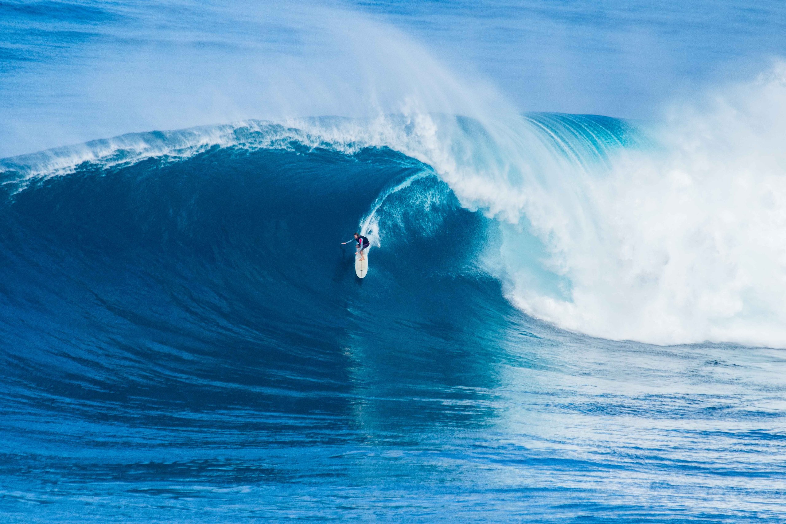 Surfing a big wave on Maui
