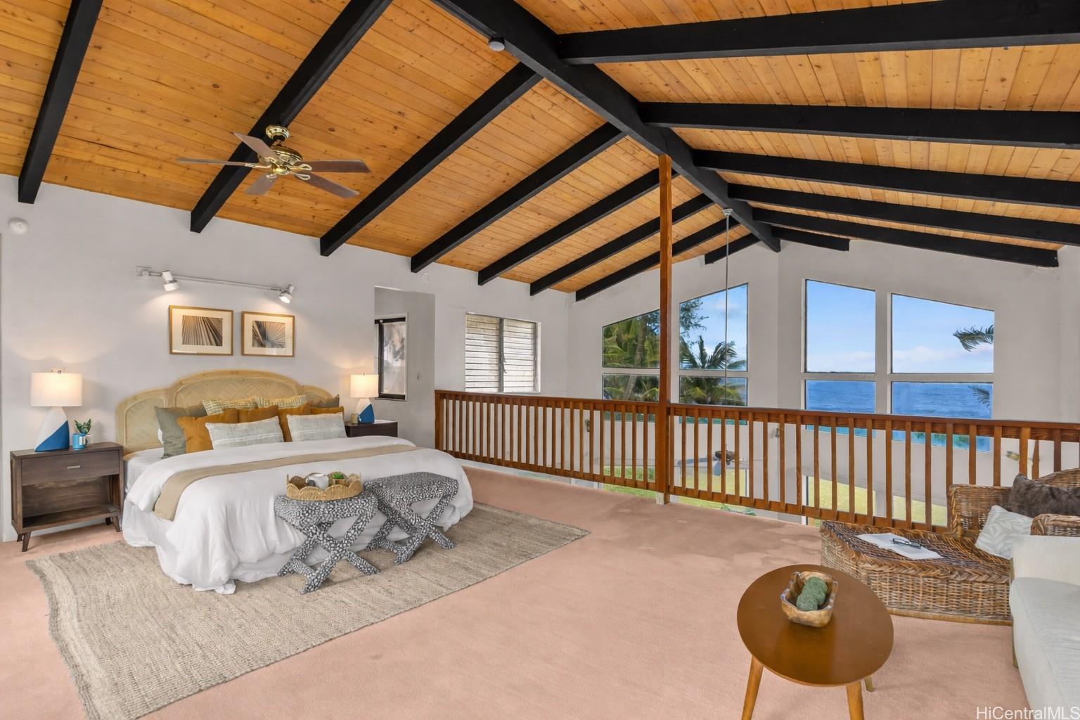 Upper level bedroom with ocean views