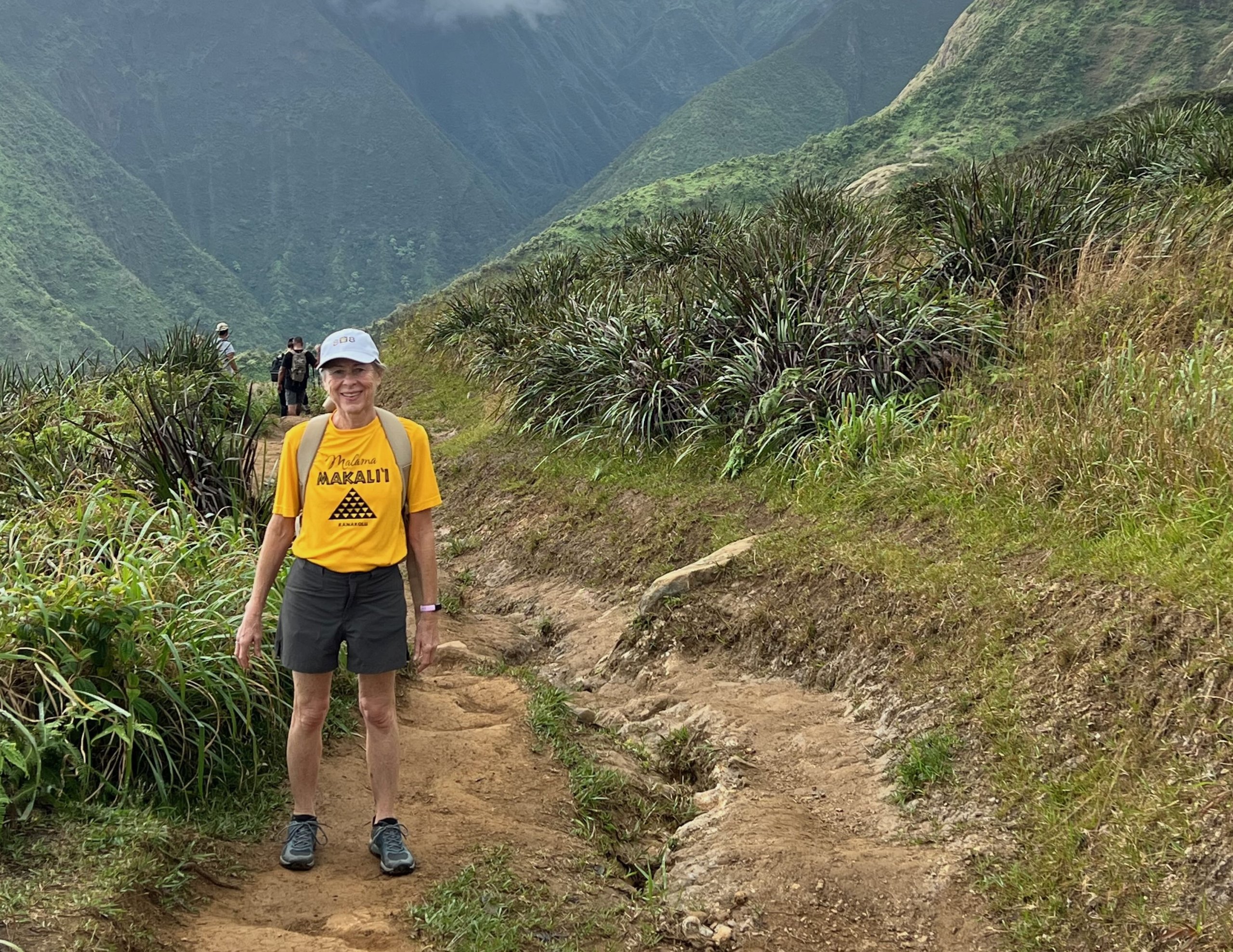 woman hiking waihee ridge trail on maui