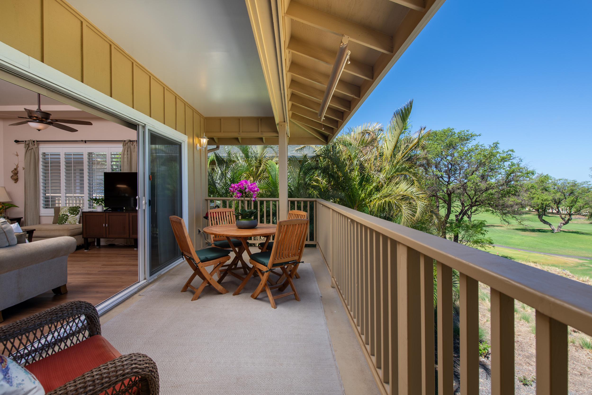 Outdoor seating on the lanai at Paniolo Gardens condo in Waikoloa Village on the Big Island