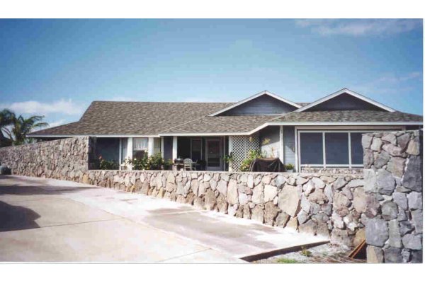 house with rock wall