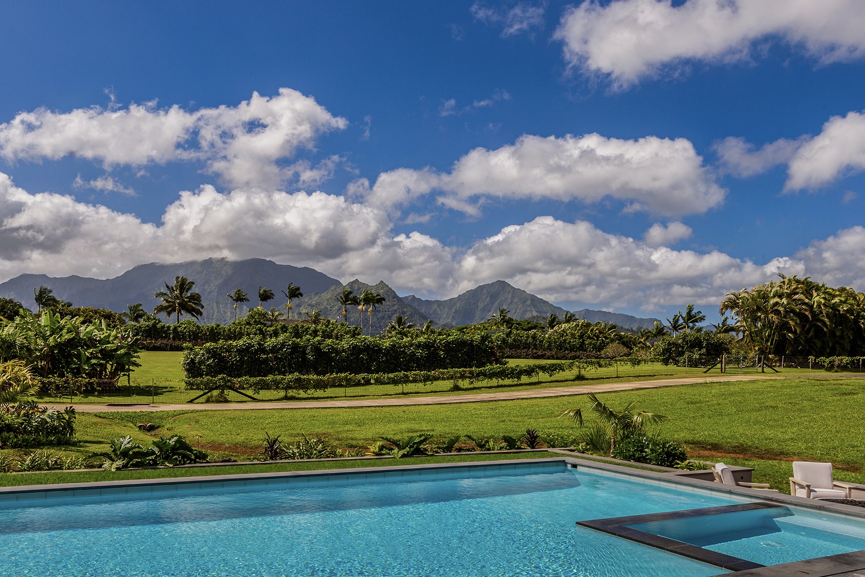 North shore kauai estate with view of mountains from pool
