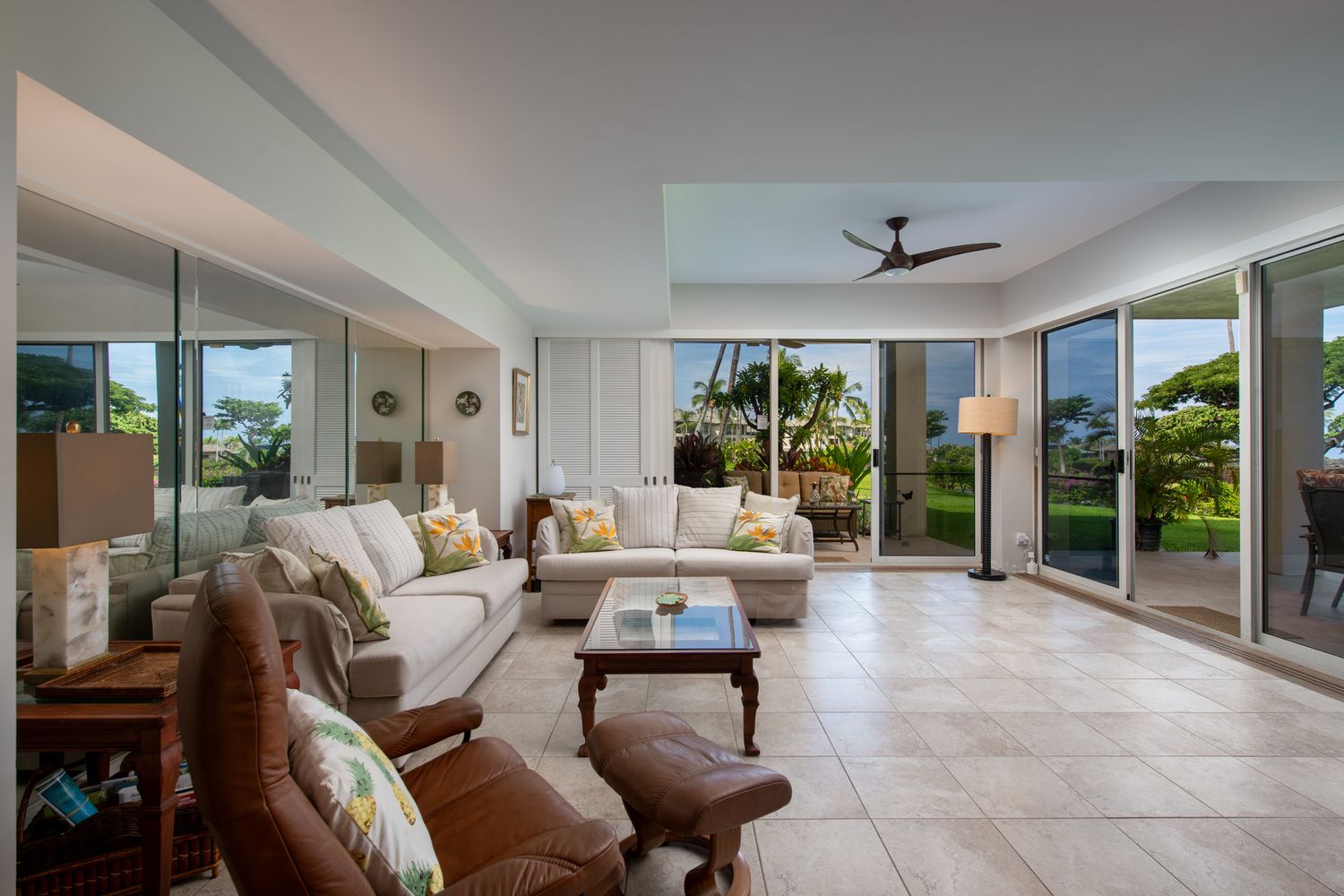 Spacious living room with sliding doors to lanai for indoor outdoor living in waikoloa village