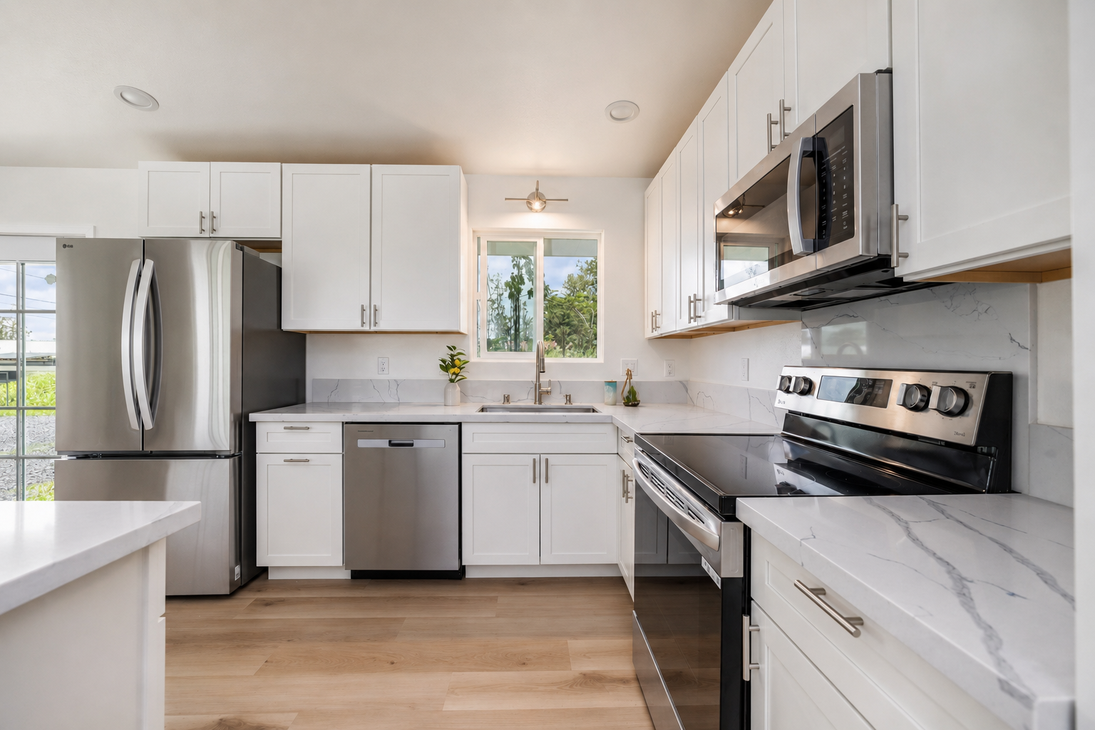 Kitchen with white cabinets and countertops