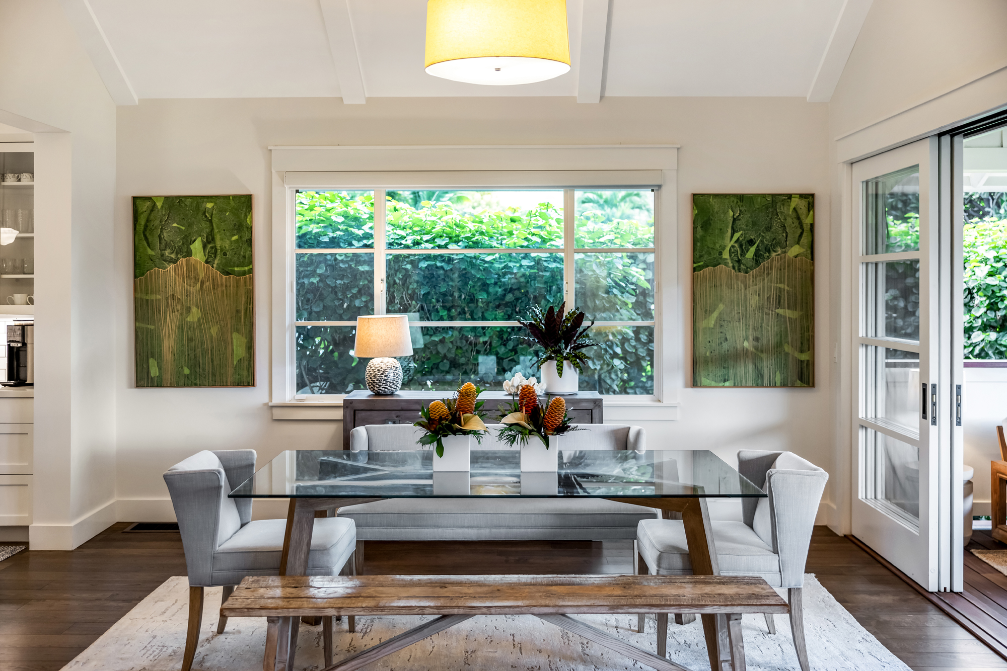 Dining room with glass table and garden views